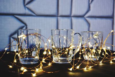 Close-up of wine glasses on table