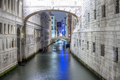 Arch bridge over canal in city