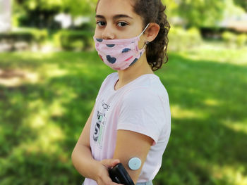 Portrait of girl standing outdoors