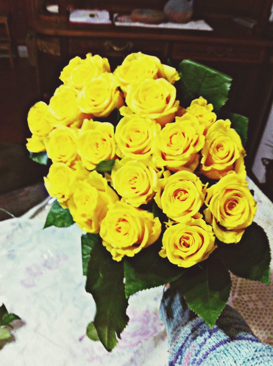 flower, freshness, petal, fragility, flower head, rose - flower, indoors, beauty in nature, high angle view, yellow, growth, close-up, nature, plant, rose, leaf, bouquet, blooming, bunch of flowers, multi colored