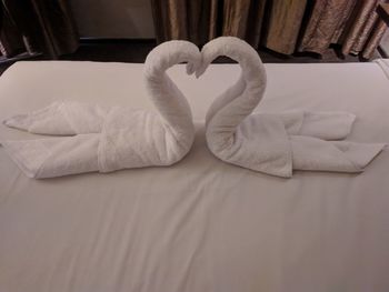 High angle view of heart shape on bed at home