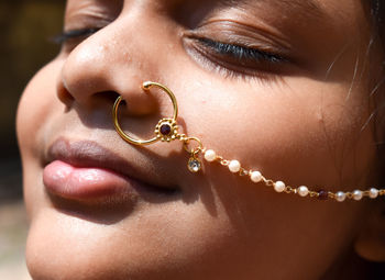 Close-up portrait of girl wearing nose ring