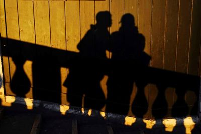 Silhouette people shadow on road