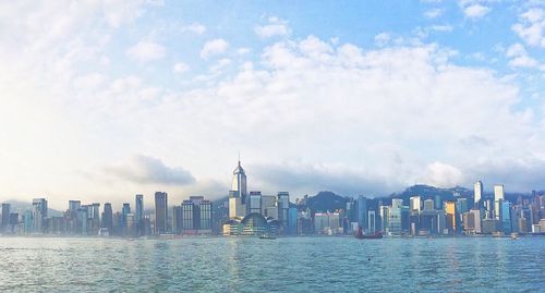 Panoramic view of buildings in city against sky