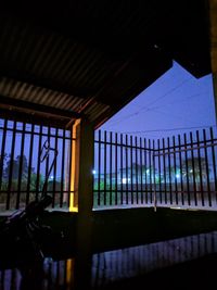 Low angle view of glass window at night