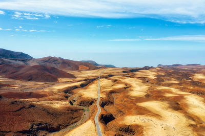 Scenic view of desert against sky