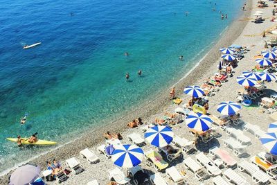 Scenic view of beach against blue sky