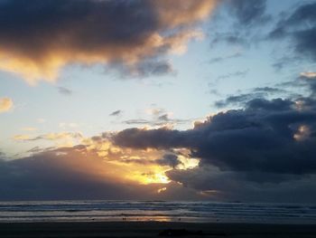 Scenic view of sea against sky at sunset