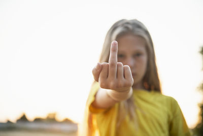 Girl showing middle finger