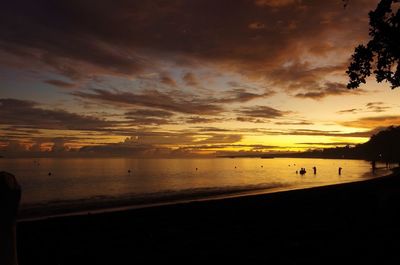 Scenic view of beach against sky during sunset