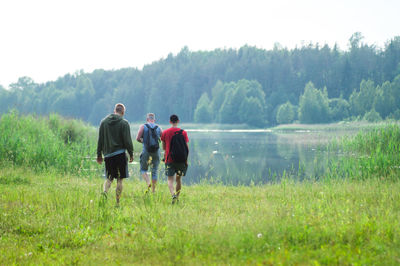 Rear view of men on field