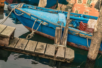 High angle view of fishing boat moored at harbor