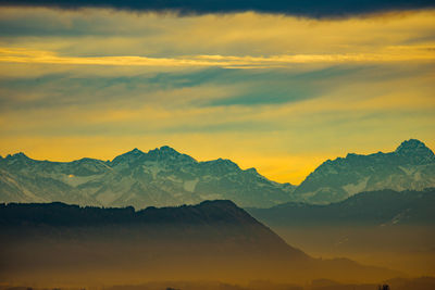 Scenic view of mountains against sky during sunset