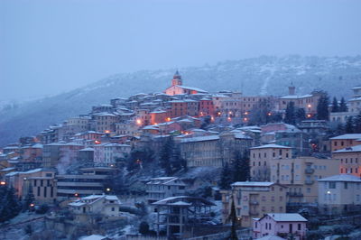 Aerial view of buildings in city during winter