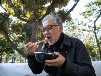 Close-up of man drinking water