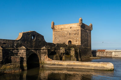 Historic building against clear blue sky