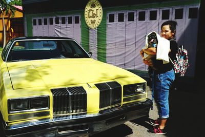 Woman standing in a car