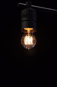 Close-up of illuminated light bulb