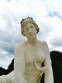 Low angle view of statue against sky