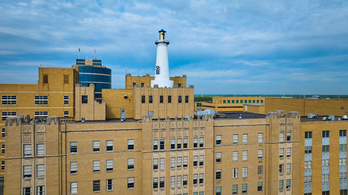 Buildings in city against sky