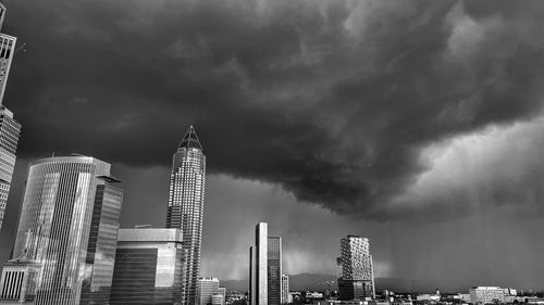 Modern buildings in city frankfurt against thunder sky