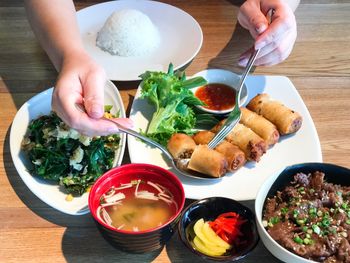 Close-up of man preparing food on table