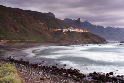 Scenic view of sea against cloudy sky