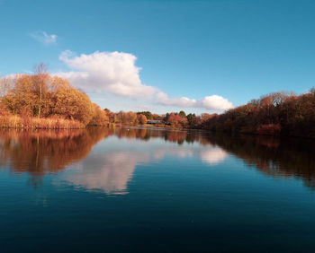 Scenic view of lake against sky during autumn