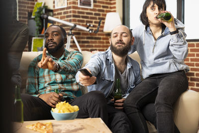 Friends toasting drinks at restaurant