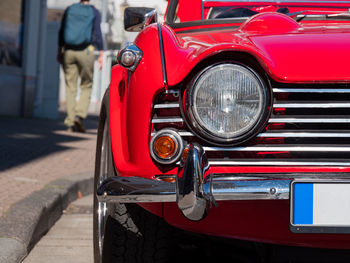 Close-up of vintage car on street