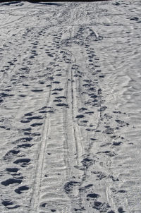 Full frame shot of tire tracks on beach