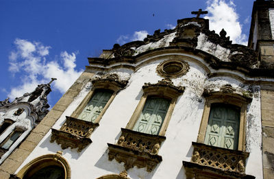 Low angle view of ornate building against sky