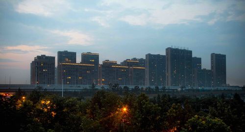 Skyscrapers in city against sky