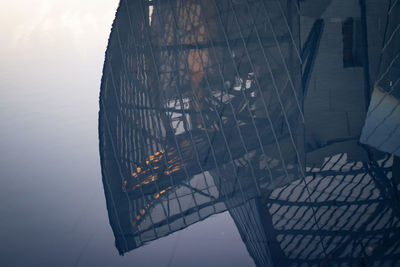 Low angle view of damaged ship against sky