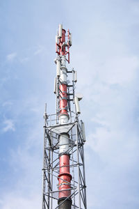 Low angle view of communications tower against sky