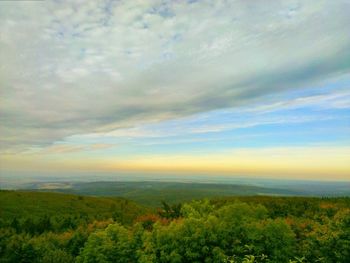 Scenic view of sea against cloudy sky