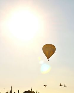 Low angle view of hot air balloons against sky during sunset