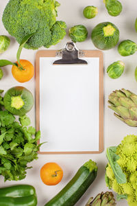 High angle view of fruits and vegetables on cutting board