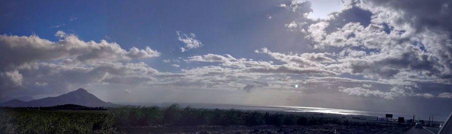 Scenic view of sea against cloudy sky