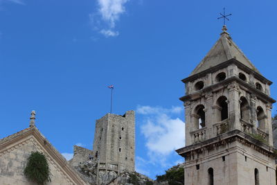 Low angle view of cathedral against blue sky