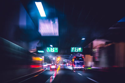 Light trails on road in city at night