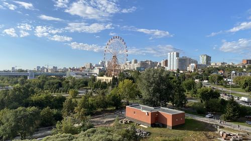 View of buildings against cloudy sky