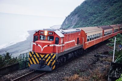 Train on railroad track against sky