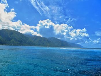 Scenic view of sea against blue sky