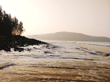 Scenic view of sea against clear sky during sunset