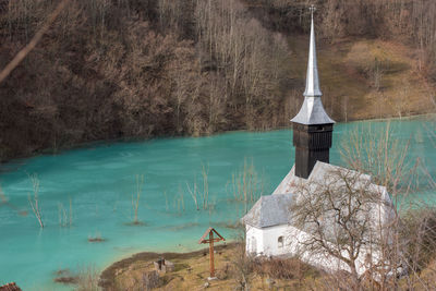 Toxic waste waters from a copper mine submerge village. abandoned orthodox church. geamana,  romania