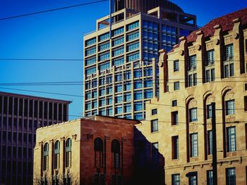 Low angle view of building against blue sky