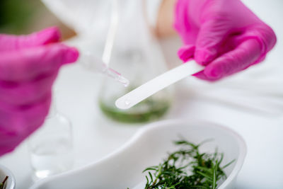 Oil dripping fragrance on perfume test paper in the lab.