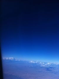 Scenic view of sea against blue sky