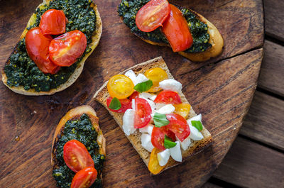 High angle view of fruits and vegetables on cutting board